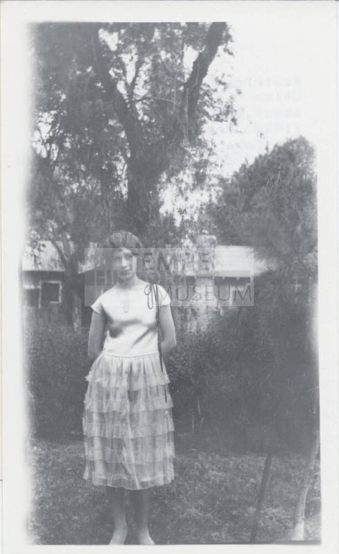 Photograph of Beatrice Felton in a Yard