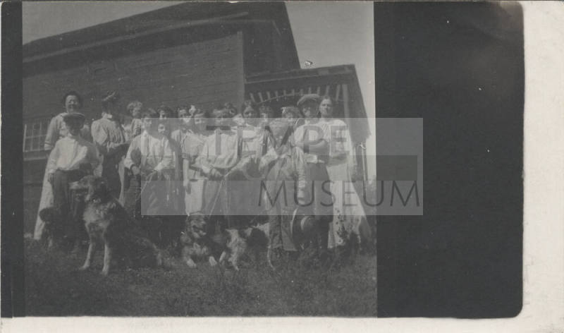 E. Craig with Group of Women, Children and Dogs