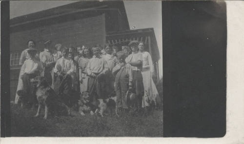 E. Craig with Group of Women, Children and Dogs