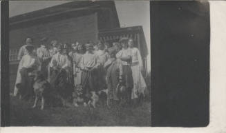 E. Craig with Group of Women, Children and Dogs