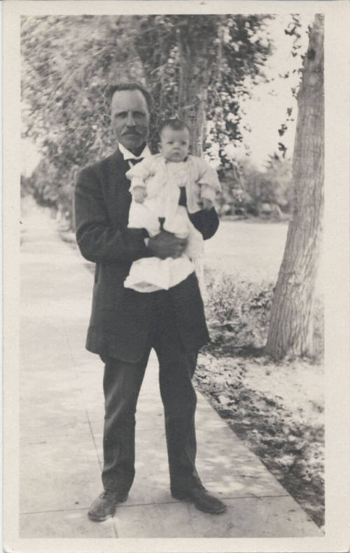Reverend John Harden with a Baby