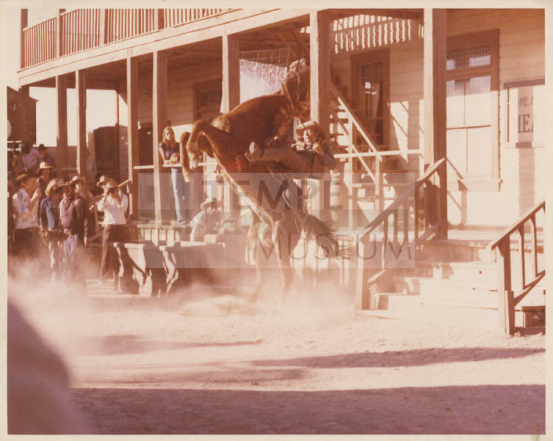 Sepia Photo of Larry Finley on a rearing horse on a western set