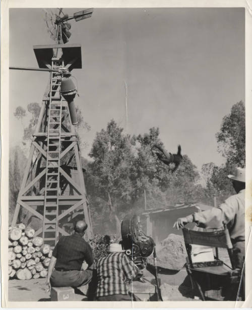 B/W Photo Movie Set with a Windmill, a Falling Man, and a Camera