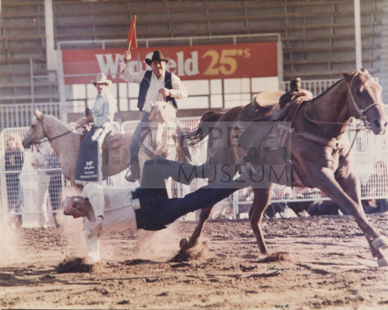 Color Rodeo Photo of Luther Finley in the 1980s, falling off a horse.