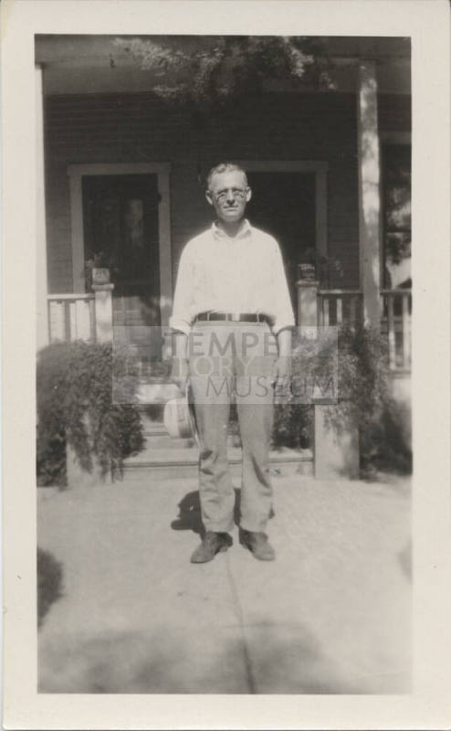 Reverend Karl Wilde in Front of His Home