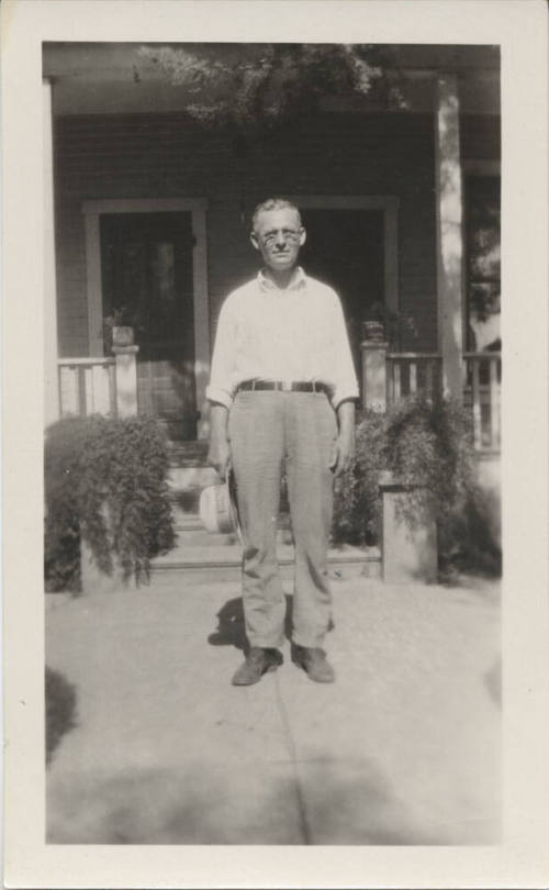 Reverend Karl Wilde in Front of His Home