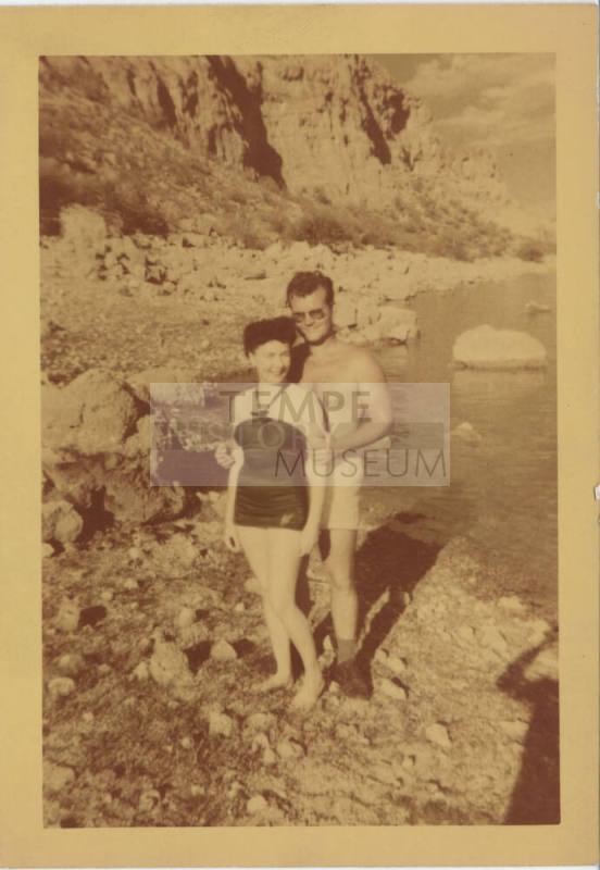 Couple in Swimwear on Rocky Shore