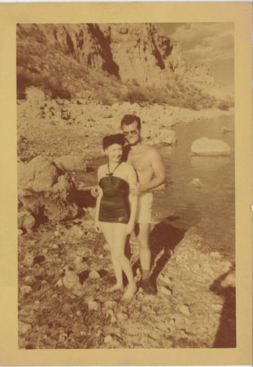 Couple in Swimwear on Rocky Shore