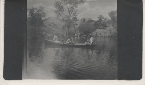 Two Rowboats with Campers on Scenic Lake