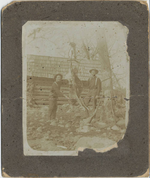 Two Hunters with Deer