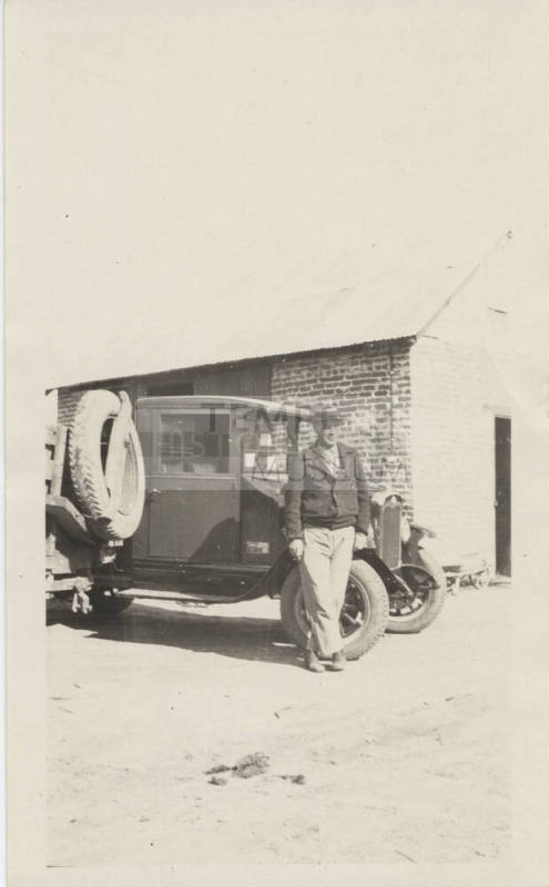Harry Hendricks Standing Beside Truck