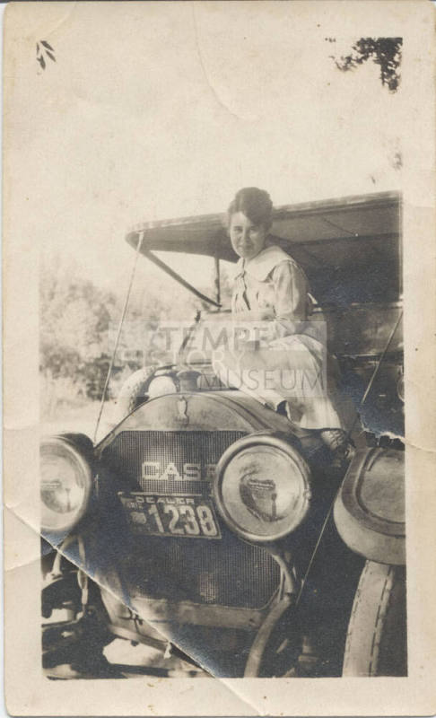 Rhoda Strong Seated on Hood of Car