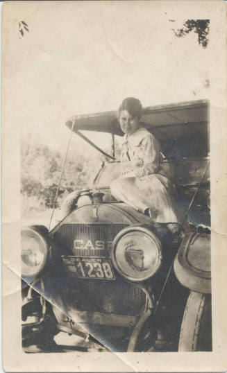 Rhoda Strong Seated on Hood of Car