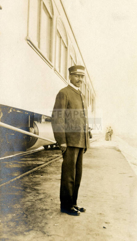 Railroad Porter Beside Train