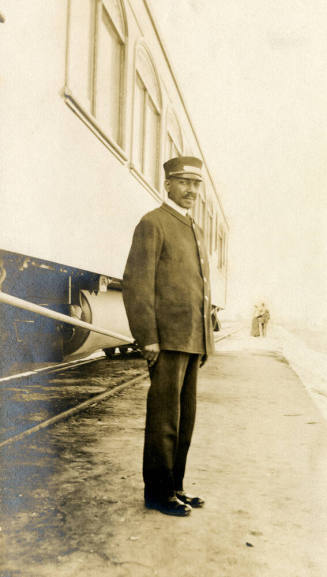 Railroad Porter Beside Train