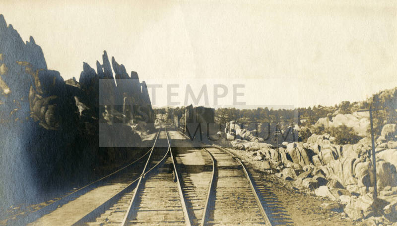 Trains on Railroad Tracks in Desert