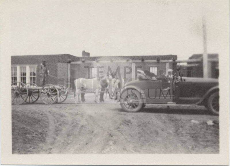 Wagon and Automobile Near Adobe House