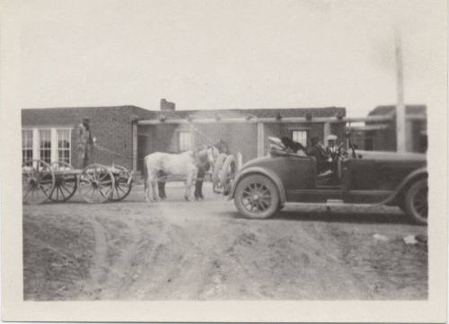 Wagon and Automobile Near Adobe House
