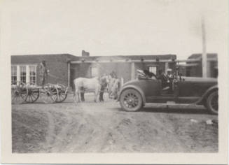 Wagon and Automobile Near Adobe House