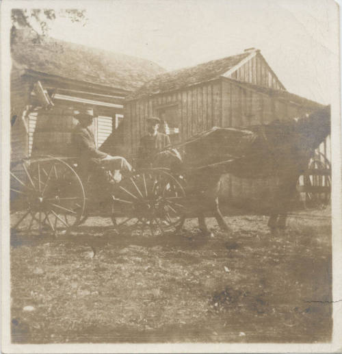 Horse and Wagon with Rider Near House