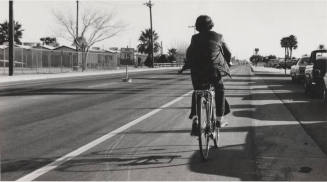 Biker on New College Avenue Bike Path