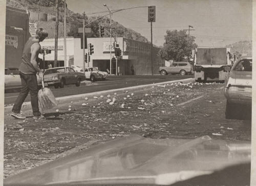 Man Cleaning Up Oranges-5th St and Mill