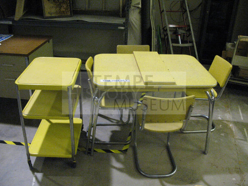 Yellow Formica Kitchen Table with leaf, four Chairs and a Gray Stand on casters