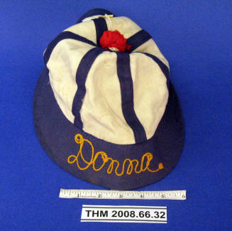 Fisherman style blue and white cap with "Donna"