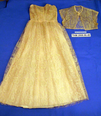 Strapless Peach Gown with a Short Jacket.