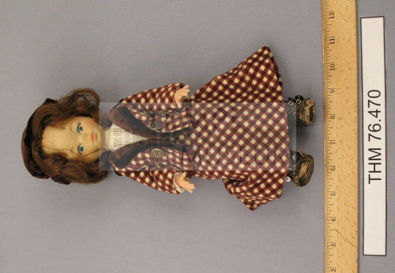 Doll wearing suit