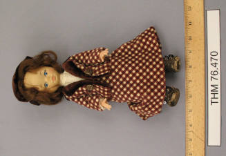 Doll wearing suit
