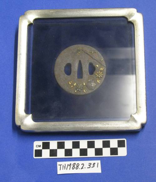 Tsuba (Japanese sword guard with flowers, teapot) framed