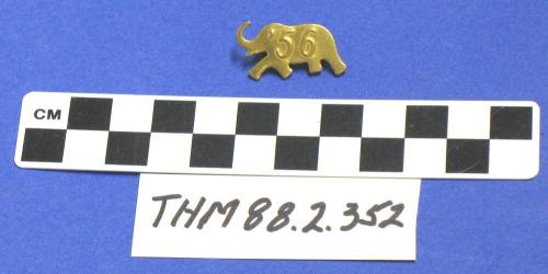 Gold metal "56" elephant pin