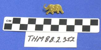 Gold metal "56" elephant pin