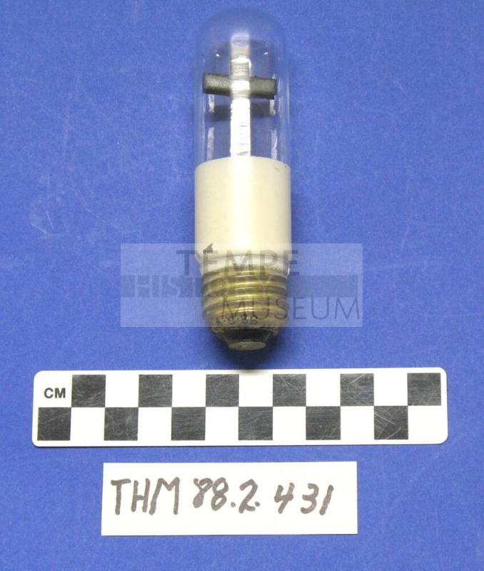 Clear light bulb with metal cross inside
