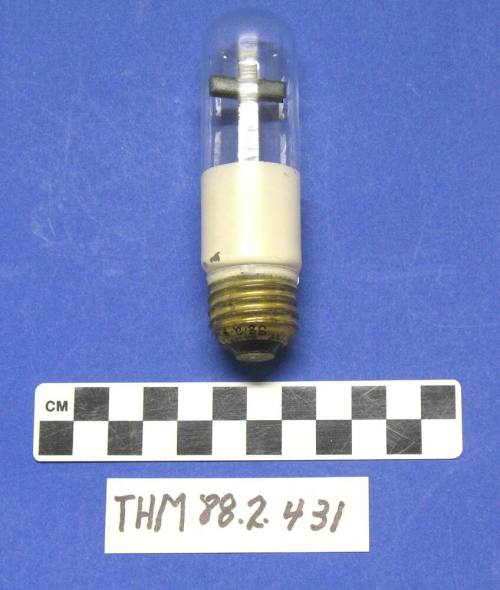 Clear light bulb with metal cross inside