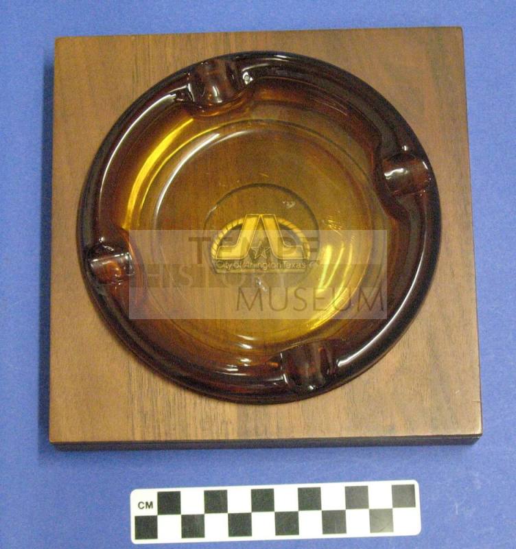 Ashtray, amber glass in wooden base from Arlington, Texas