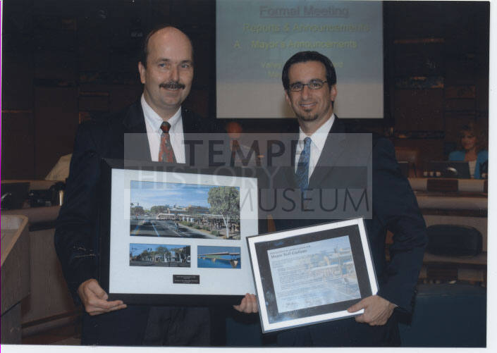 Photograph of the Presentation of Recognition Certificate from Valley Metro Rail to Mayor Giuliano at Formal Tempe Council