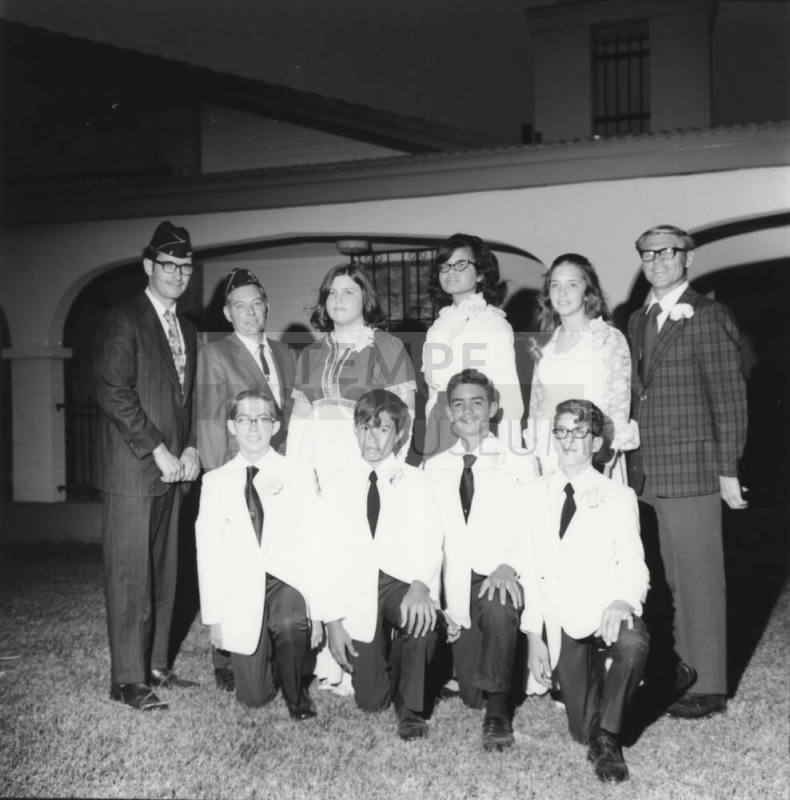 Ten young adults in dress clothing