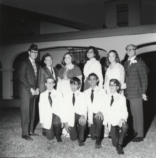 Ten young adults in dress clothing