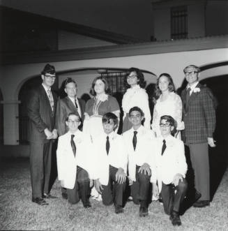 Ten young adults in dress clothing