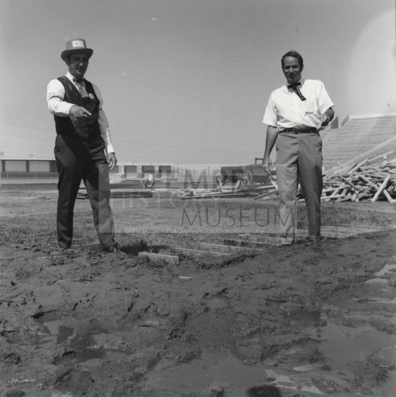 Men Standing in A Field - Bleachers