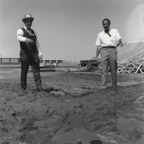 Men Standing in A Field - Bleachers
