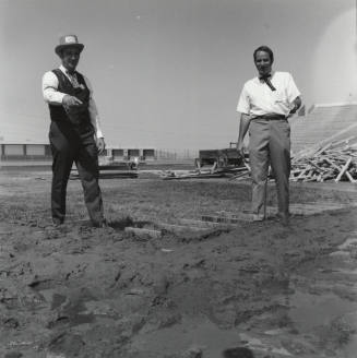 Men Standing in A Field - Bleachers