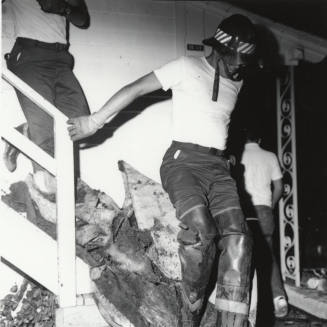 Henry Hammer Cleaning Up After Fire