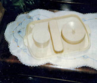 cold cream case  and matching clothes brush