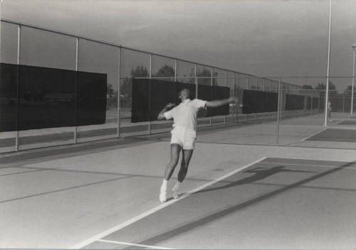 Unidentified Man Playing Tennis at Kiwanis Recreation Center in Kiwanis Park