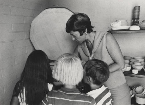 Eva Vichules Loads Kiln for Kid's Ceramic Class
