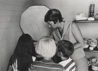 Eva Vichules Loads Kiln for Kid's Ceramic Class