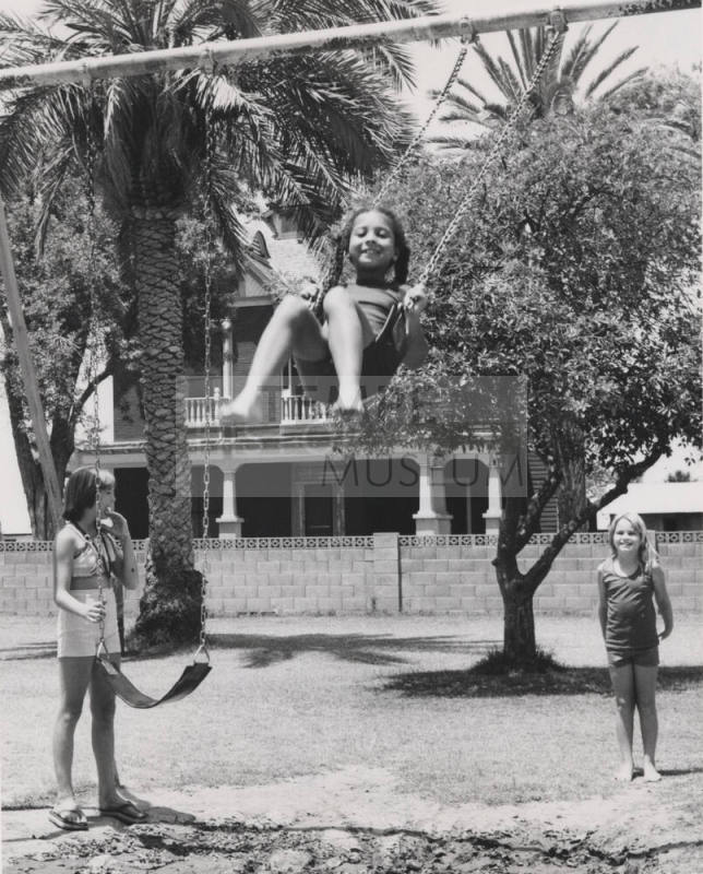Children on Swing - Playing at Petersen House